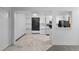Open kitchen area showcasing the modern appliances, chalkboard wall, and seamless flow into the living space at 1074 S Dearborn St # 103, Aurora, CO 80012