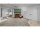 Comfortable living room boasts a fireplace, soft carpet, and access to a balcony at 1074 S Dearborn St # 103, Aurora, CO 80012