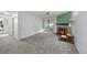 Spacious living room features a cozy fireplace, plush carpeting, and sliding glass door for natural light at 1074 S Dearborn St # 103, Aurora, CO 80012