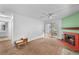 Inviting living room features a cozy fireplace, sliding glass doors, and neutral carpet at 1074 S Dearborn St # 103, Aurora, CO 80012