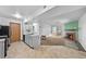 Open-concept layout showcasing the kitchen, dining area, and cozy living room with a fireplace at 1074 S Dearborn St # 103, Aurora, CO 80012