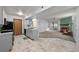 Open-concept living area connects the kitchen to a comfortable living room with a fireplace at 1074 S Dearborn St # 103, Aurora, CO 80012