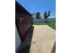 The backyard area features a small concrete patio and privacy fence at 275 Mckinley Dr, Bennett, CO 80102