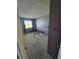 Cozy bedroom with large window providing natural light and small closet at 275 Mckinley Dr, Bennett, CO 80102