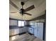 Updated kitchen with stainless steel appliances, granite countertops, and ample cabinet space at 275 Mckinley Dr, Bennett, CO 80102