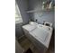 Laundry room area featuring a washer and dryer, shelving and window at 275 Mckinley Dr, Bennett, CO 80102