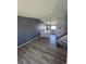 Open living area featuring hardwood floors and seamless flow to the adjacent kitchen, perfect for entertaining at 275 Mckinley Dr, Bennett, CO 80102