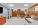 Basement area featuring wood paneling, built-in shelving, and comfortable seating at 4040 Ames St, Wheat Ridge, CO 80212