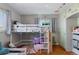 bedroom featuring a lofted bed, cartoon decor, and natural light at 4040 Ames St, Wheat Ridge, CO 80212