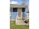 Welcoming front door with security screen and concrete porch steps at 4040 Ames St, Wheat Ridge, CO 80212