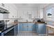 Bright kitchen with updated cabinetry, butcher block countertops, and modern appliances at 4040 Ames St, Wheat Ridge, CO 80212