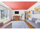 Cozy living room features hardwood floors, a statement ceiling and an abundance of natural light at 4040 Ames St, Wheat Ridge, CO 80212