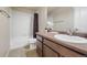 Bathroom with a shower/tub combo, single vanity, and good lighting at 6916 Crestop Pl # F, Parker, CO 80138
