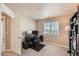 Bedroom with a window, carpeted floor, and a work area at 6916 Crestop Pl # F, Parker, CO 80138