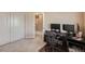 Bright bedroom featuring a modern work space with computer and dual monitors plus great natural lighting at 6916 Crestop Pl # F, Parker, CO 80138