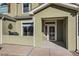 Home's inviting front entrance features a stylish door, visible house number, and covered porch at 6916 Crestop Pl # F, Parker, CO 80138