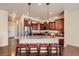 Gourmet kitchen featuring stainless steel appliances, granite countertops, and breakfast bar seating at 6916 Crestop Pl # F, Parker, CO 80138