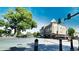 Charming street view with shops, restaurants, and a lush tree at 6916 Crestop Pl # F, Parker, CO 80138