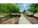 Beautiful walkway with landscaped grounds and trees at 6916 Crestop Pl # F, Parker, CO 80138
