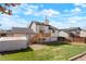 Well-maintained backyard featuring a patio area, grassy area, and storage shed with privacy fence surround at 12050 Dahlia Dr, Thornton, CO 80241