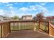 Spacious wood deck overlooking a large backyard with lush green grass and mature trees at 12050 Dahlia Dr, Thornton, CO 80241