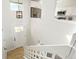 Open entryway with white stairs, white railings, view of the kitchen, and view of the yard at 12050 Dahlia Dr, Thornton, CO 80241