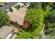 Aerial view of the property showcasing the well-maintained lawn, mature trees, and inviting outdoor deck at 6407 S Heritage W Pl, Centennial, CO 80111
