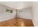 Spacious bedroom with beautiful hardwood floors and ample natural light at 6407 S Heritage W Pl, Centennial, CO 80111