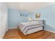 Cozy bedroom with hardwood floors and a bright, cheerful atmosphere at 6407 S Heritage W Pl, Centennial, CO 80111
