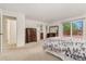 Spacious bedroom with a neutral carpet and access to the wooden deck, creating a tranquil and connected living space at 6407 S Heritage W Pl, Centennial, CO 80111
