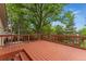 Exterior deck surrounded by lush greenery, offering a serene space for relaxation and enjoying the natural beauty at 6407 S Heritage W Pl, Centennial, CO 80111