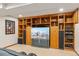 Basement entertainment center with custom wood built-ins and a modern television at 6407 S Heritage W Pl, Centennial, CO 80111