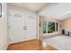 Inviting foyer with hardwood floors and decorative double doors at 6407 S Heritage W Pl, Centennial, CO 80111