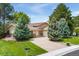 Charming home with a well-manicured lawn and mature landscaping at 6407 S Heritage W Pl, Centennial, CO 80111