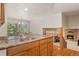 Charming kitchen features a stone countertop, stainless steel sink, and an open-concept layout at 6407 S Heritage W Pl, Centennial, CO 80111