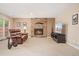 Inviting living room with stone fireplace, plush sofa, and ample natural light from sliding glass doors at 6407 S Heritage W Pl, Centennial, CO 80111