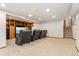 Large living room features theater chairs, built-in cabinets, and a staircase at 6407 S Heritage W Pl, Centennial, CO 80111