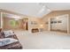 Open-concept living room with multiple doorways and vaulted ceilings at 6407 S Heritage W Pl, Centennial, CO 80111