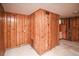 Basement room featuring paneled walls and access to other rooms at 1195 Boston St, Aurora, CO 80010