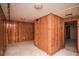 Basement room with paneled walls, showing natural wood texture at 1195 Boston St, Aurora, CO 80010