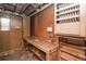 Unfinished basement with work bench and storage at 1195 Boston St, Aurora, CO 80010