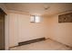 Unfinished basement with visible pipes, one window, and concrete floor offers potential for customization at 1195 Boston St, Aurora, CO 80010