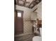 Bathroom with tiled shower, a mirror, and exposed wall areas shows some visible water damage at 1195 Boston St, Aurora, CO 80010