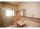 Bathroom with a glass-enclosed shower and vintage sink at 1195 Boston St, Aurora, CO 80010
