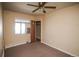 Bedroom with a ceiling fan and window at 1195 Boston St, Aurora, CO 80010
