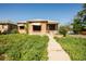 Charming brick home with a walkway, showing the potential for landscaping and curb appeal at 1195 Boston St, Aurora, CO 80010