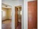 Hallway with doors leading to a bedroom and bathroom, plus a linen closet at 1195 Boston St, Aurora, CO 80010