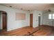 Living area showcasing hardwood floors, arched doorways, and vintage charm, ready for renovation at 1195 Boston St, Aurora, CO 80010