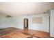 Spacious living room featuring hardwood floors and arched doorway, offering a classic layout at 1195 Boston St, Aurora, CO 80010