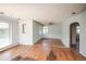 Open living room with hardwood floors, ceiling fan, lots of natural light, and fresh paint at 1195 Boston St, Aurora, CO 80010